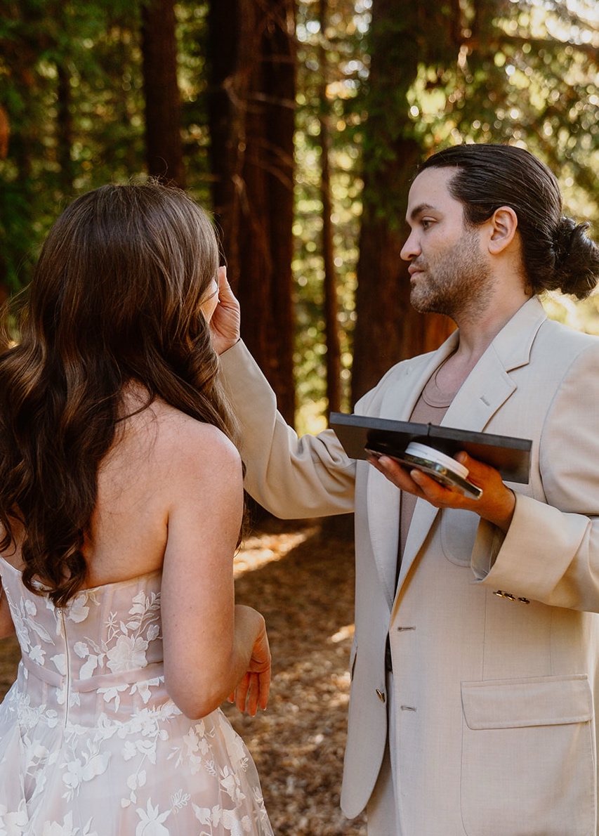 Carwin Brice with bride — forest touch-up behind the scenes